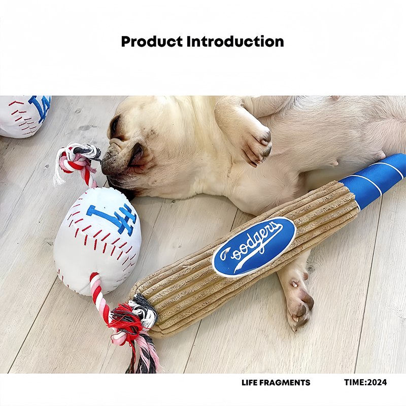 Dog playing with a squeaky plush baseball and bat toy set